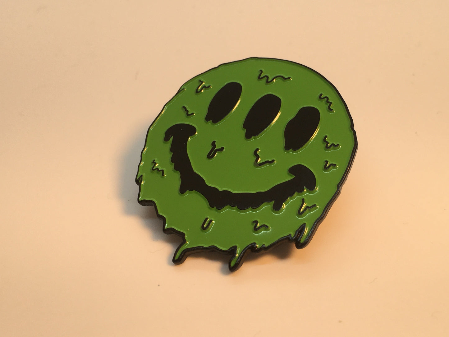 3 Eyed Green Smiley Face Melting Pin